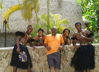 Group photo with dancers in traditional attire.