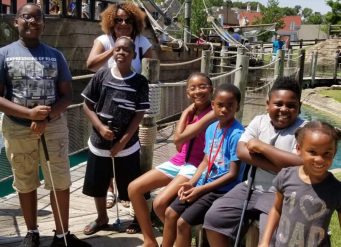 Group of children at pirate ship mini-golf